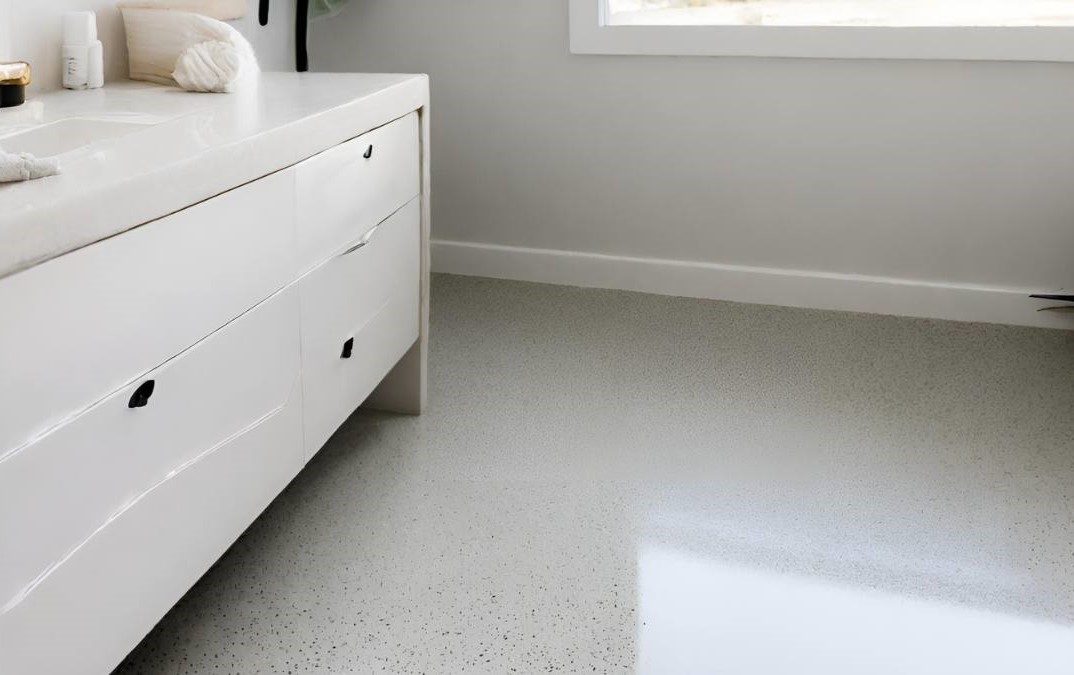 Insulated concrete floor for a bathroom