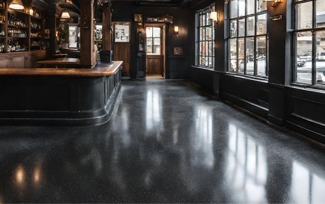 Black aggregate concrete flooring in a restaurant.