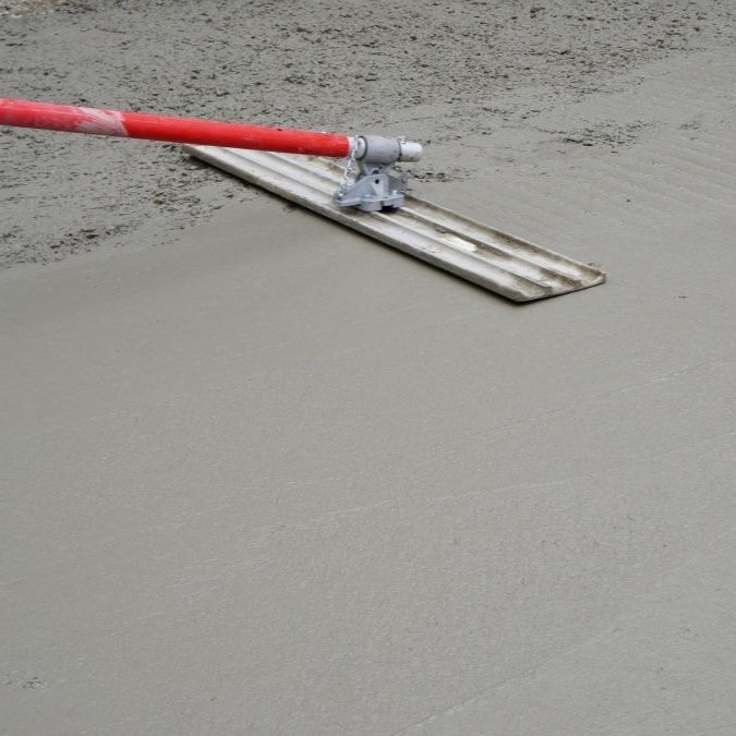 cement being smoothed with a bull float.